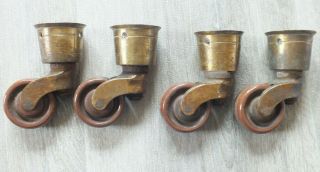 4 Antique Brass Cup Castors; Brown Ceramic Wheels