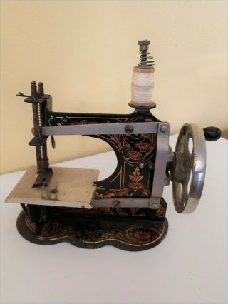 Casige Antique Toy Sewing Machine Hand Crank Scalloped Base.
