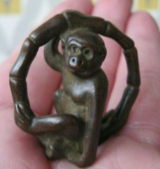Japanese Meiji Style Bronze Okimono Of A Monkey Playing Inside A Bamboo Ring