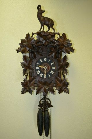 Antique Cuckoo Clock with a Ram on top of the topper very rare 12