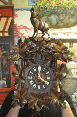 Antique Cuckoo Clock with a Ram on top of the topper very rare 2