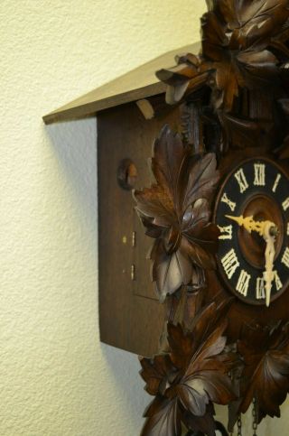 Antique Cuckoo Clock with a Ram on top of the topper very rare 8