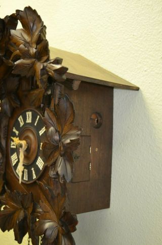 Antique Cuckoo Clock with a Ram on top of the topper very rare 9