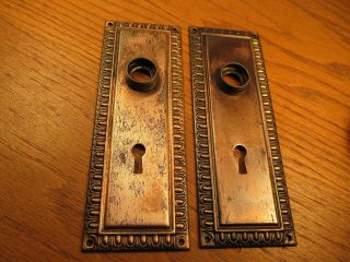 Pair Old Stamped Brass Plated Door Knob Backplates.  Escutcheons.