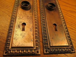 PAIR OLD STAMPED BRASS PLATED DOOR KNOB BACKPLATES.  ESCUTCHEONS. 2