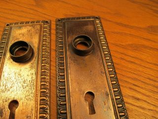 PAIR OLD STAMPED BRASS PLATED DOOR KNOB BACKPLATES.  ESCUTCHEONS. 6