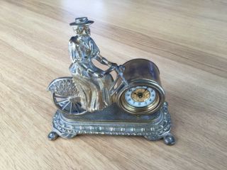 Lady On Bicycle By British United.  Clock Co.  Ltd.