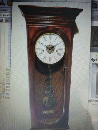 Howard Miller 8 Day Chiming German Wall Clock With & Embossed Lyre Pendulum