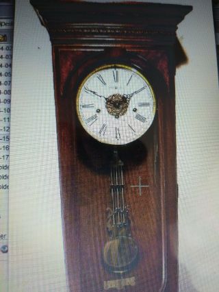 Howard Miller 8 Day Chiming German Wall Clock With & Embossed Lyre Pendulum 7