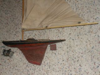 Early pond boat with fishing reel. 3