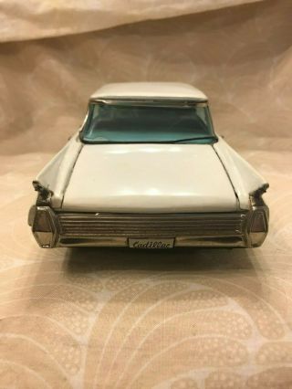 VINTAGE SIGN OF QUALITY CADILLAC 4 - DOOR TIN TOY CAR WHITE (A22) 6