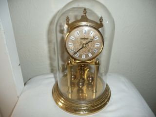 Kundo Anniversary Clock In Glass Dome,  Miniature Movement.  For Restoration.