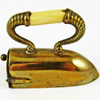 ANTIQUE CLOTHES IRON FIGURAL BRASS WIND - UP SEWING TAPE MEASURE 3