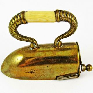 ANTIQUE CLOTHES IRON FIGURAL BRASS WIND - UP SEWING TAPE MEASURE 6