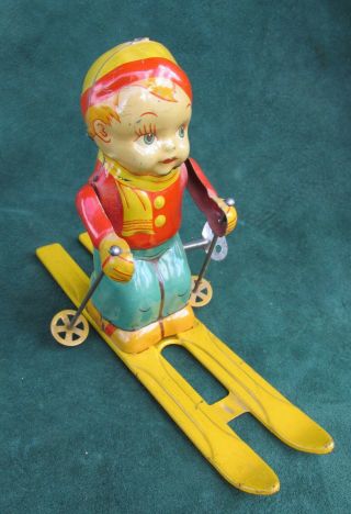Vintage Wind Up Tin Toy Skier By J Chien