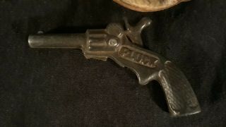 100 year old cast Iron Pluck Cap Gun.  Cow hair holster perfectly. 2