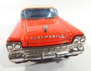 NT Cragstan Oldsmobile 88 Red Tin Toy Friction Car Litho Interior 4