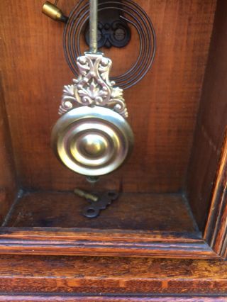 ansonia gingerbread clock vintage,  has key and a pendulum but no glass 3