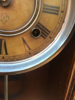 ansonia gingerbread clock vintage,  has key and a pendulum but no glass 5