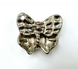 Early Realistic Plaster Butterfly Button With Silver Colored Surface.
