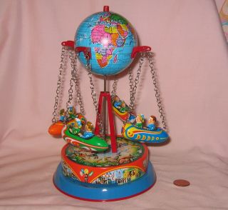Vintage Tin Wind - Up Merry - Go - Round Globe With 4 Rockets.  Made In Germany