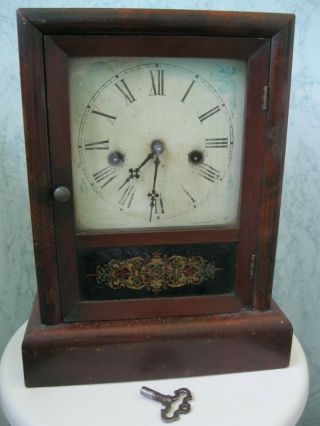 Antique Waterbury Striking Mantel Shelf Clock,  With Key And Pendulum.