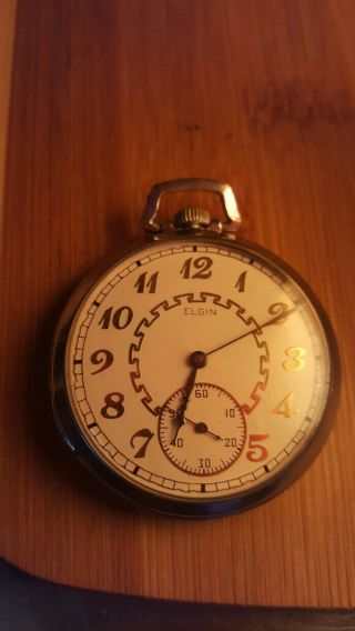 Vintage Elgin 12 size pocket watch.  Not running.  Parts or to fix.  Fancy dial. 7