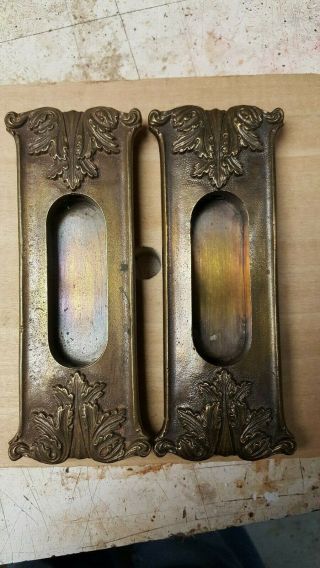 Antique cast brass pocket door handles 2