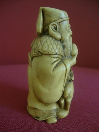 Oriental hand carving of old man with deer.  Height 3ins.  (7.  5cms) 3