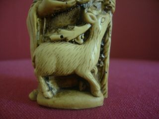 Oriental hand carving of old man with deer.  Height 3ins.  (7.  5cms) 5