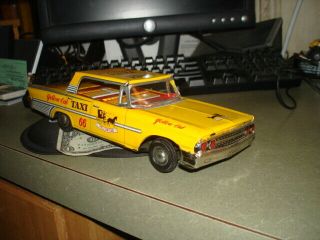 Vintage Japan Tin Friction Yellow Taxi Cab Toy Great Shape Ford Fairlane