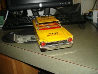 VINTAGE JAPAN TIN FRICTION YELLOW TAXI CAB TOY GREAT SHAPE FORD FAIRLANE 3