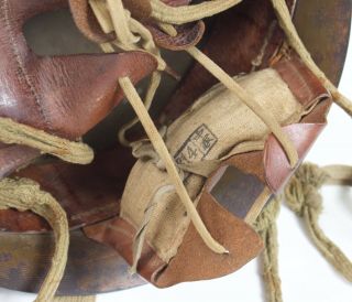 Imperial Japanese Army helmet,  leather liner,  canvas straps,  star badge 10