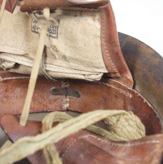 Imperial Japanese Army helmet,  leather liner,  canvas straps,  star badge 12