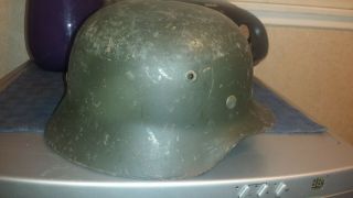 M 40 German helmet with liner.  No chinstrap.  Shows wear. 2