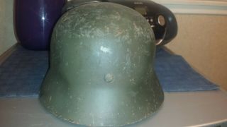 M 40 German helmet with liner.  No chinstrap.  Shows wear. 3