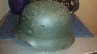 M 40 German helmet with liner.  No chinstrap.  Shows wear. 4