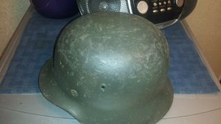M 40 German helmet with liner.  No chinstrap.  Shows wear. 5