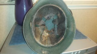 M 40 German helmet with liner.  No chinstrap.  Shows wear. 7