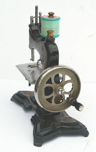 Antique cast - iron toy/miniature sewing machine 3