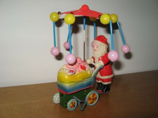 Vtg Wind Up Toy Santa Claus Celluloid Tin Litho Spinning Umbrella Cart Of Toys