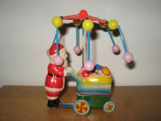Vtg Wind Up Toy Santa Claus Celluloid Tin Litho Spinning Umbrella Cart of Toys 2