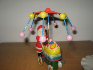 Vtg Wind Up Toy Santa Claus Celluloid Tin Litho Spinning Umbrella Cart of Toys 3