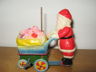 Vtg Wind Up Toy Santa Claus Celluloid Tin Litho Spinning Umbrella Cart of Toys 4