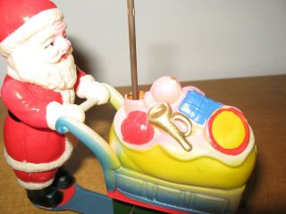 Vtg Wind Up Toy Santa Claus Celluloid Tin Litho Spinning Umbrella Cart of Toys 6