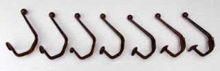 7 French Art Deco Shabby Chic Pressed Steel Industrial Coat Hooks.