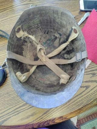 Vintage Military Helmet With Other Military Items.