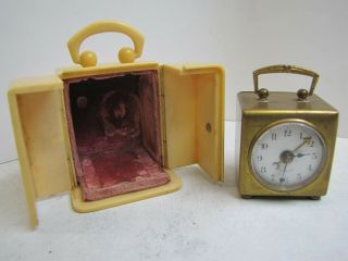 An Early Square Miniature German Alarm Clock In Travelling Case