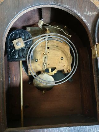 vintage wooden mantle clock with key ticks,  chimes but movement needs a 3