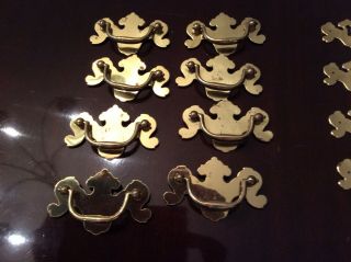 8 vintage polished brass 2 1/2 inch drawer pulls and 4 key plates 2